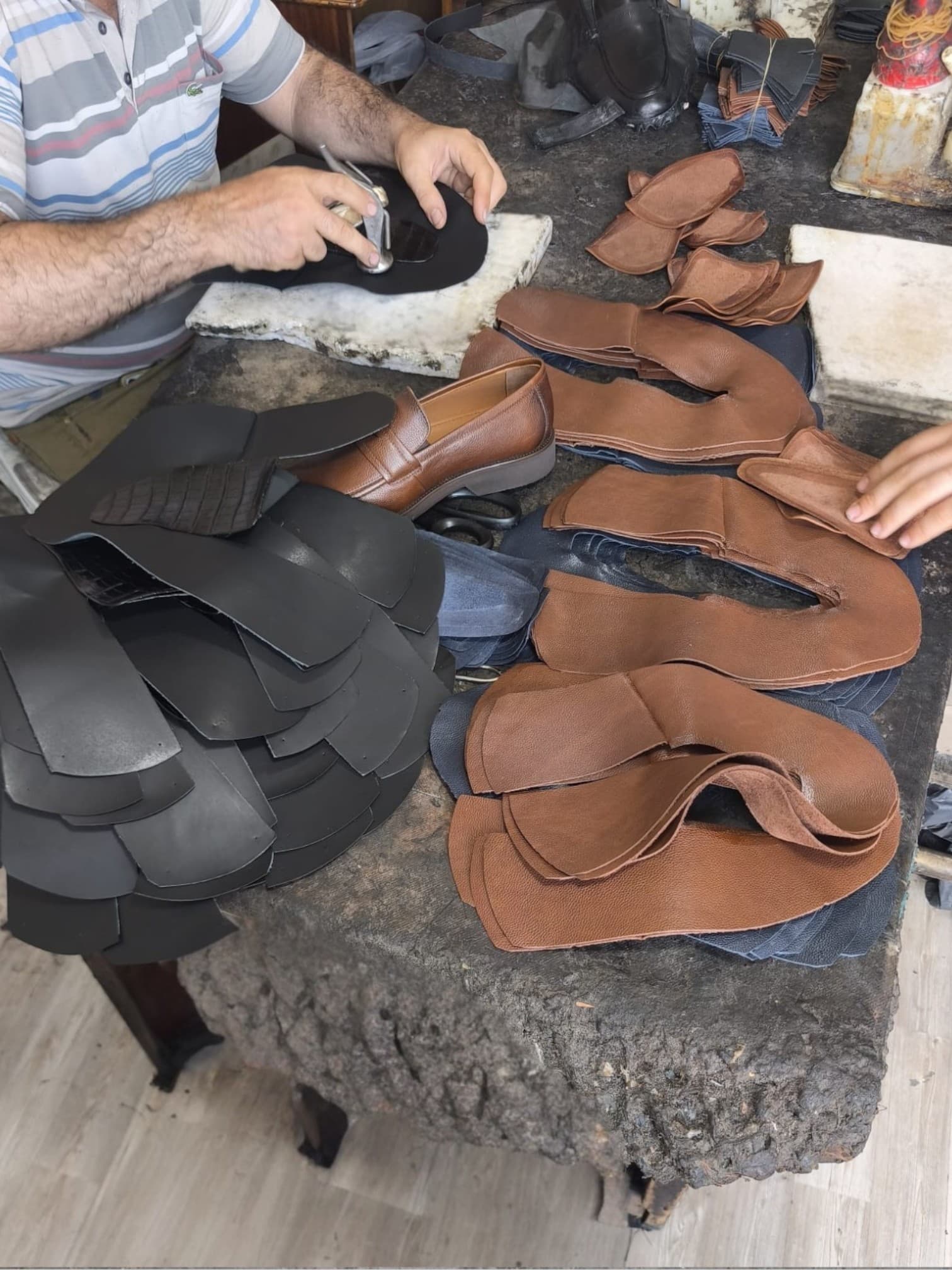 Craftsman working on leather shoe uppers in the Patrizio Lucca workshop in Gaziantep